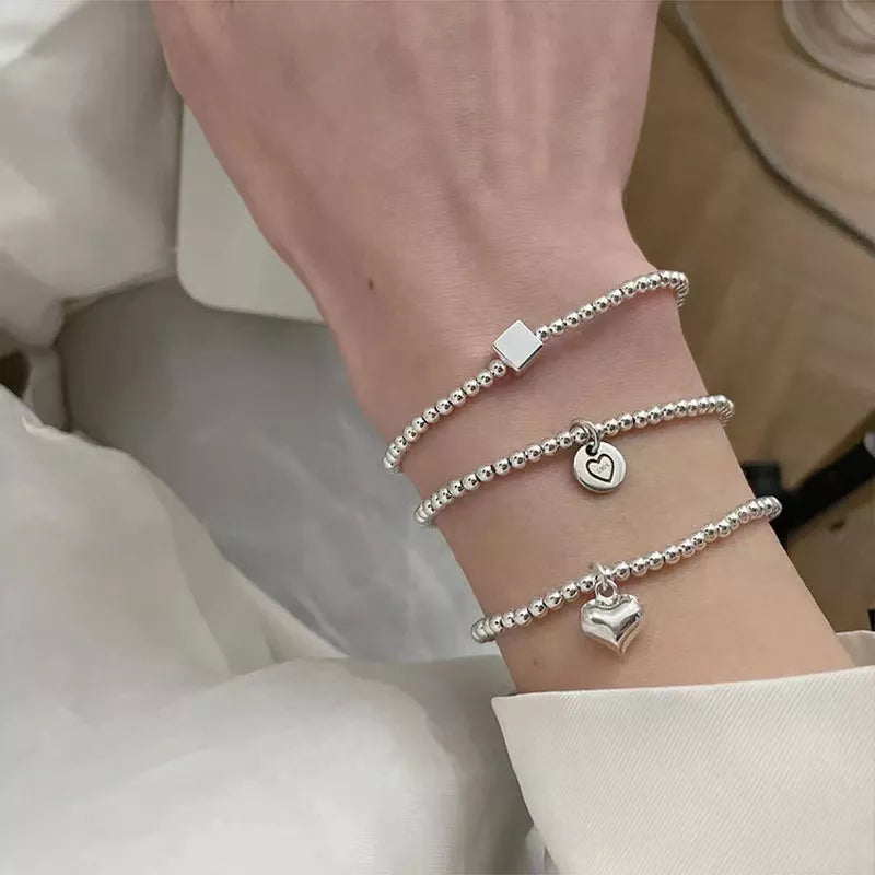 Sterling Silver Round Bead Bracelet: Versatile Charm Jewelry